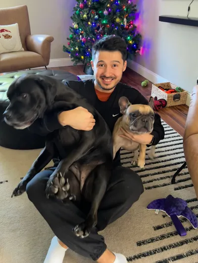 Nikolay with two dogs